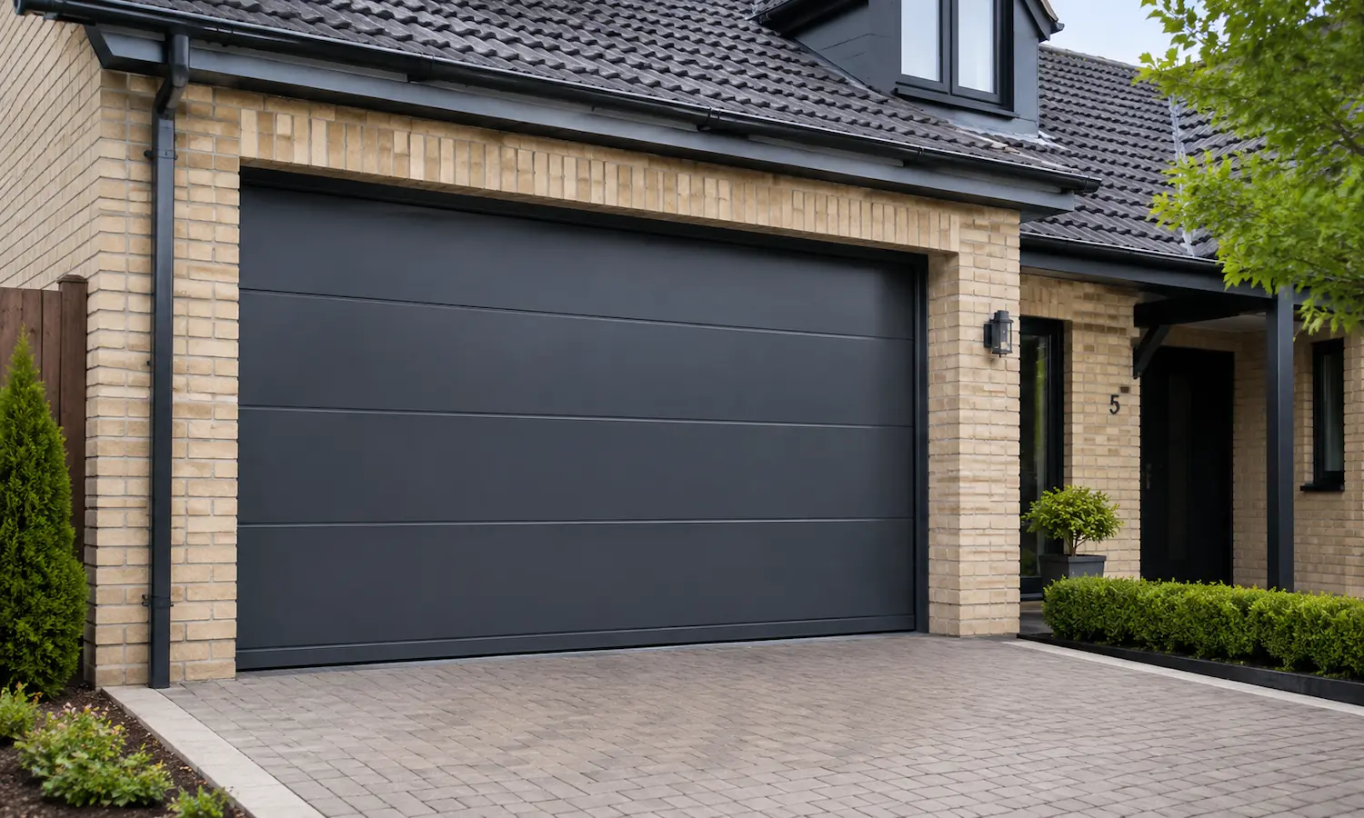 Automatic sectional garage door fitted to a residential property